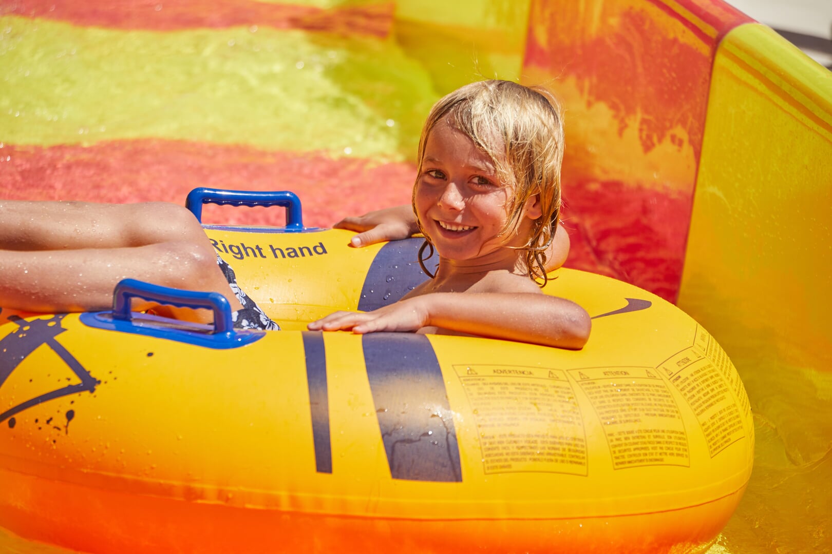 child on a water slide
