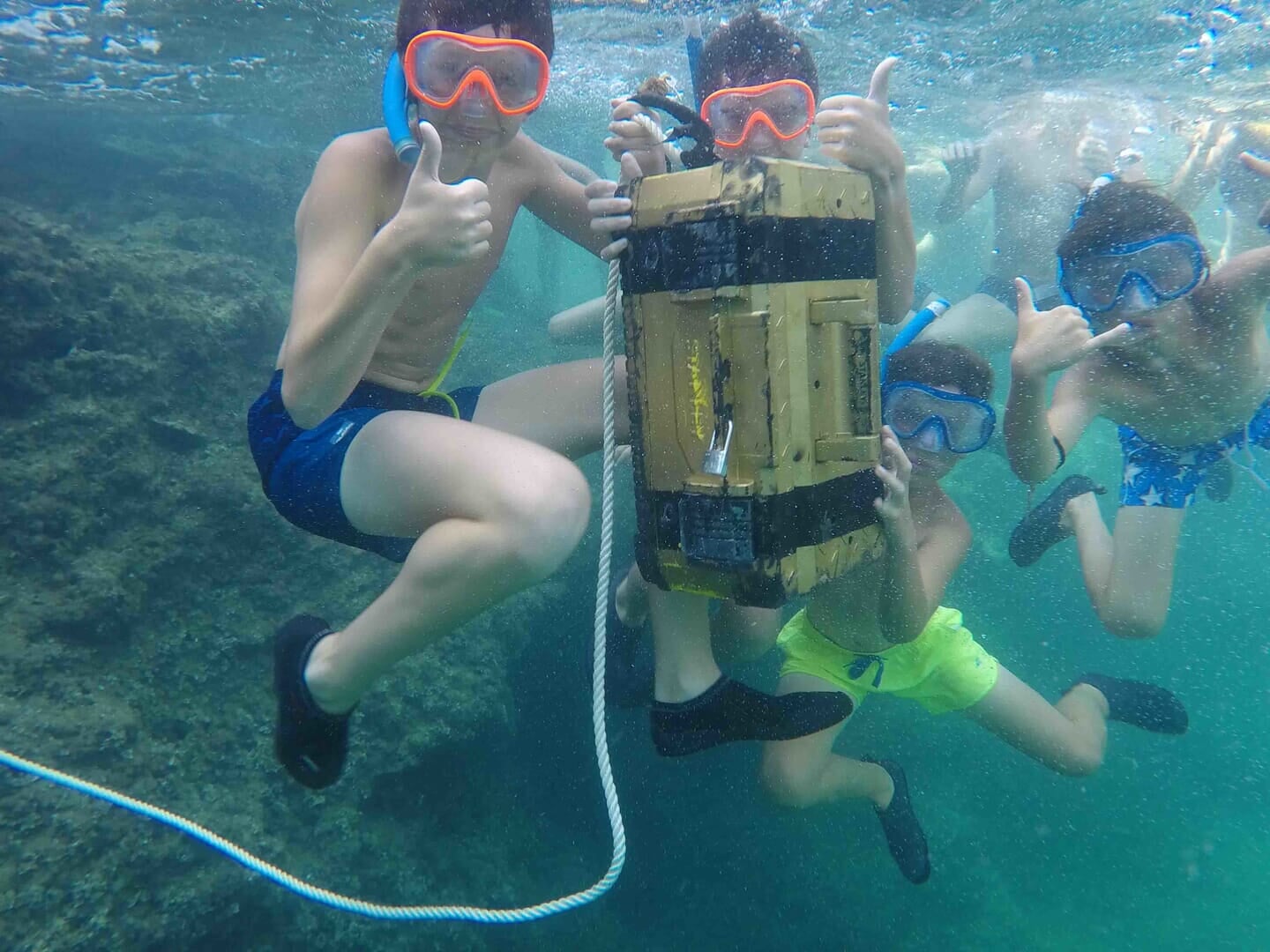 Children finding the treasure in the sea